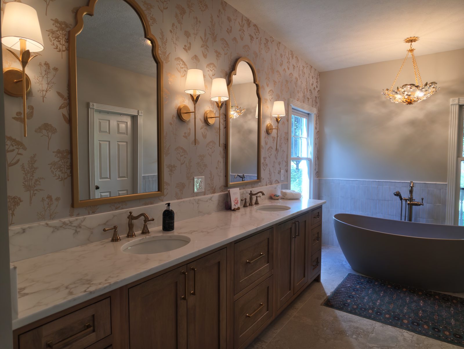 Primary bathroom remodel with freestanding soaking tub and stained oak double vanity Noblesville Indiana