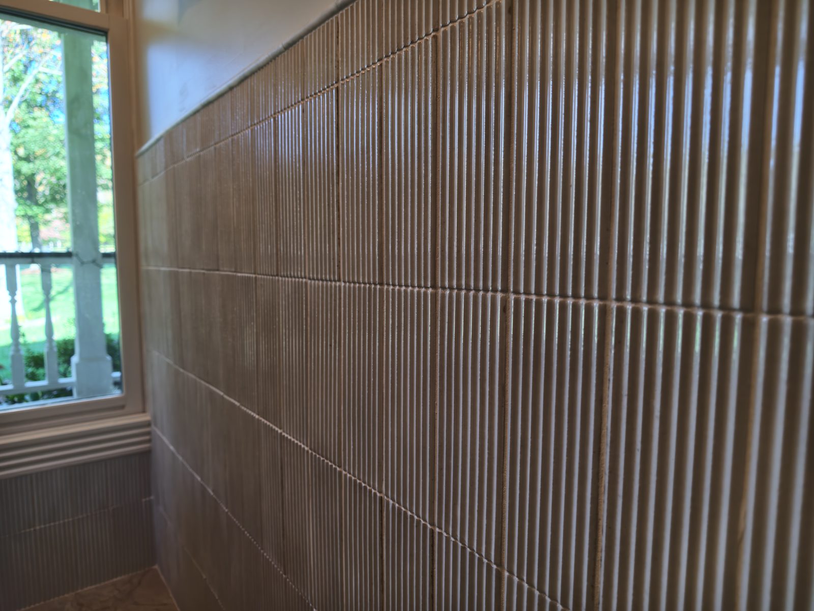Fluted tile wainscot detail in primary bathroom Noblesville IN