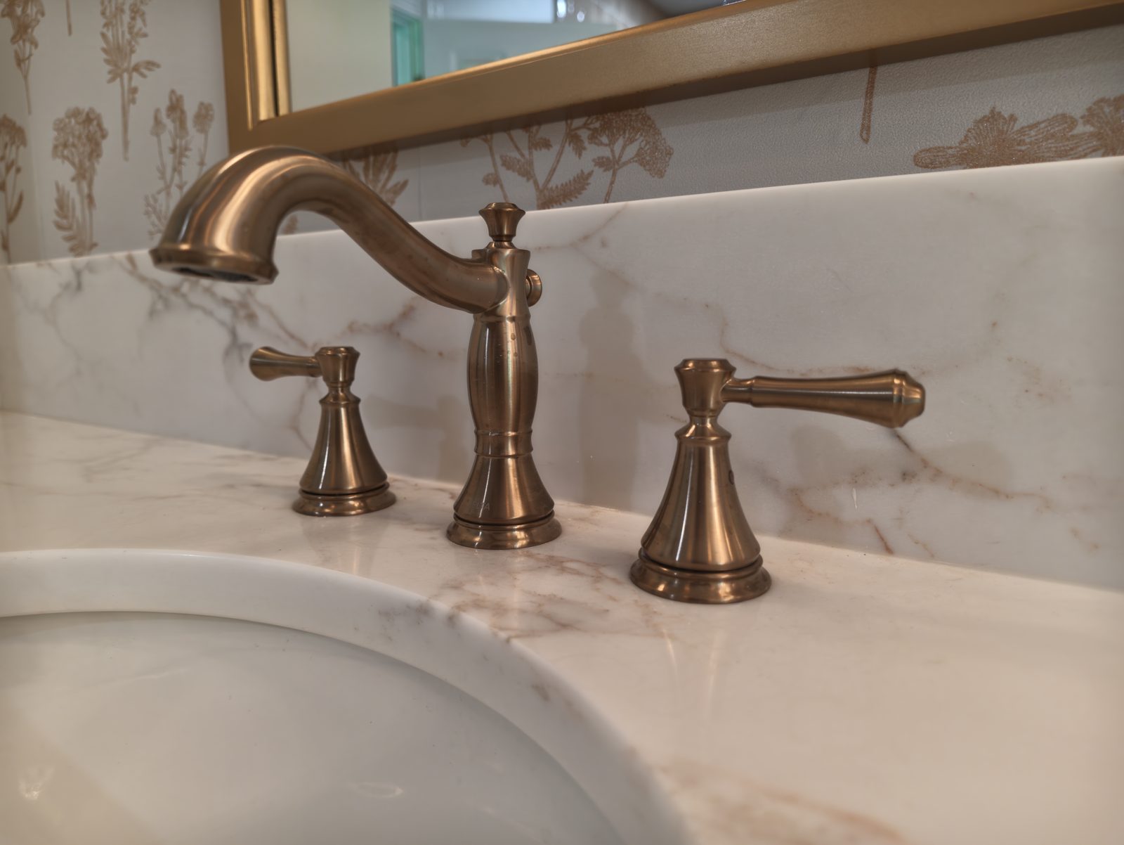 Champagne bronze widespread faucet on stone vanity top Noblesville IN