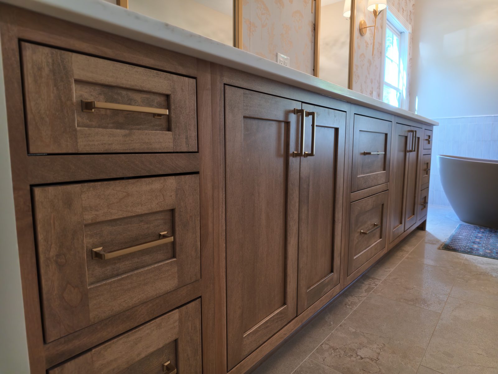 Stained oak double vanity cabinetry detail primary bathroom Noblesville IN