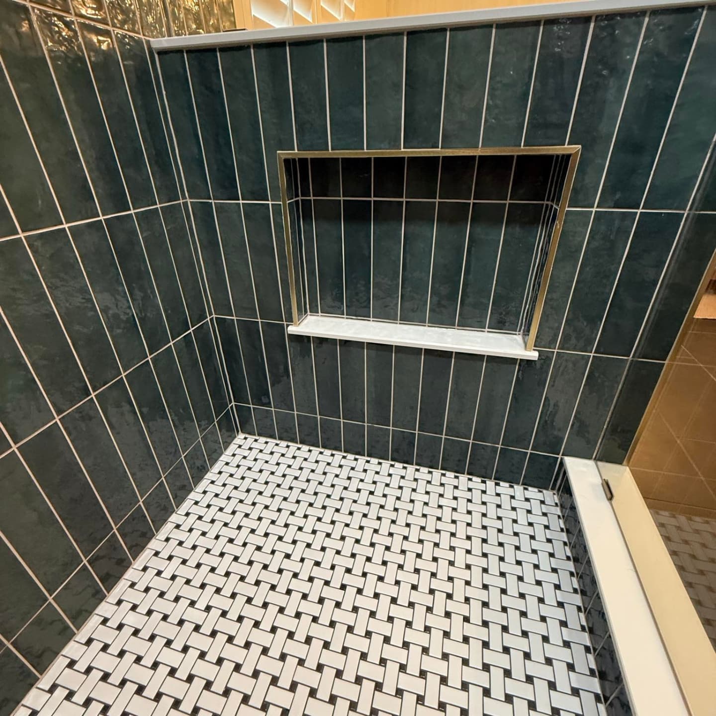 Custom vanity in green tile bathroom Carmel Indiana