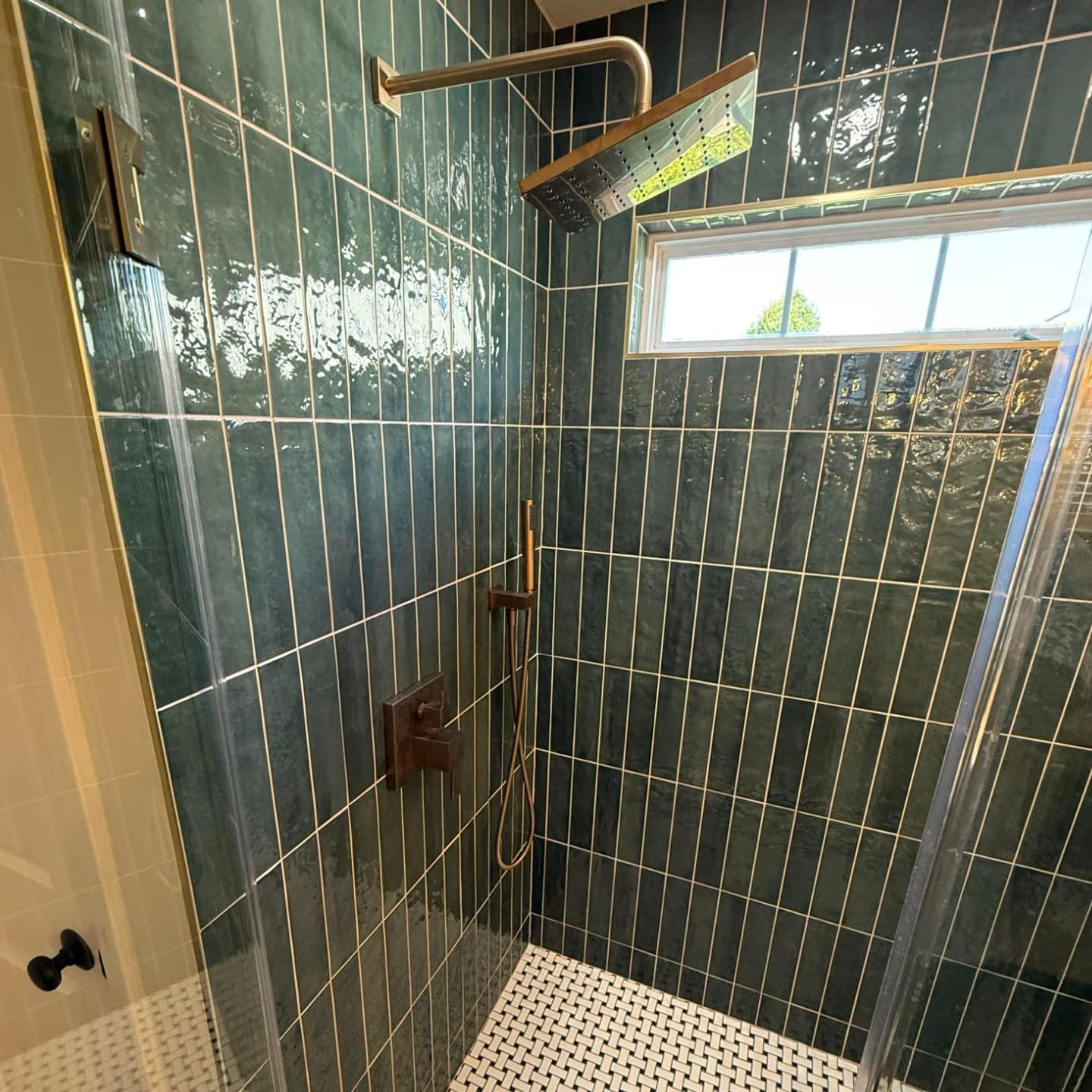 Bathroom remodel with green tile accents Carmel Indiana
