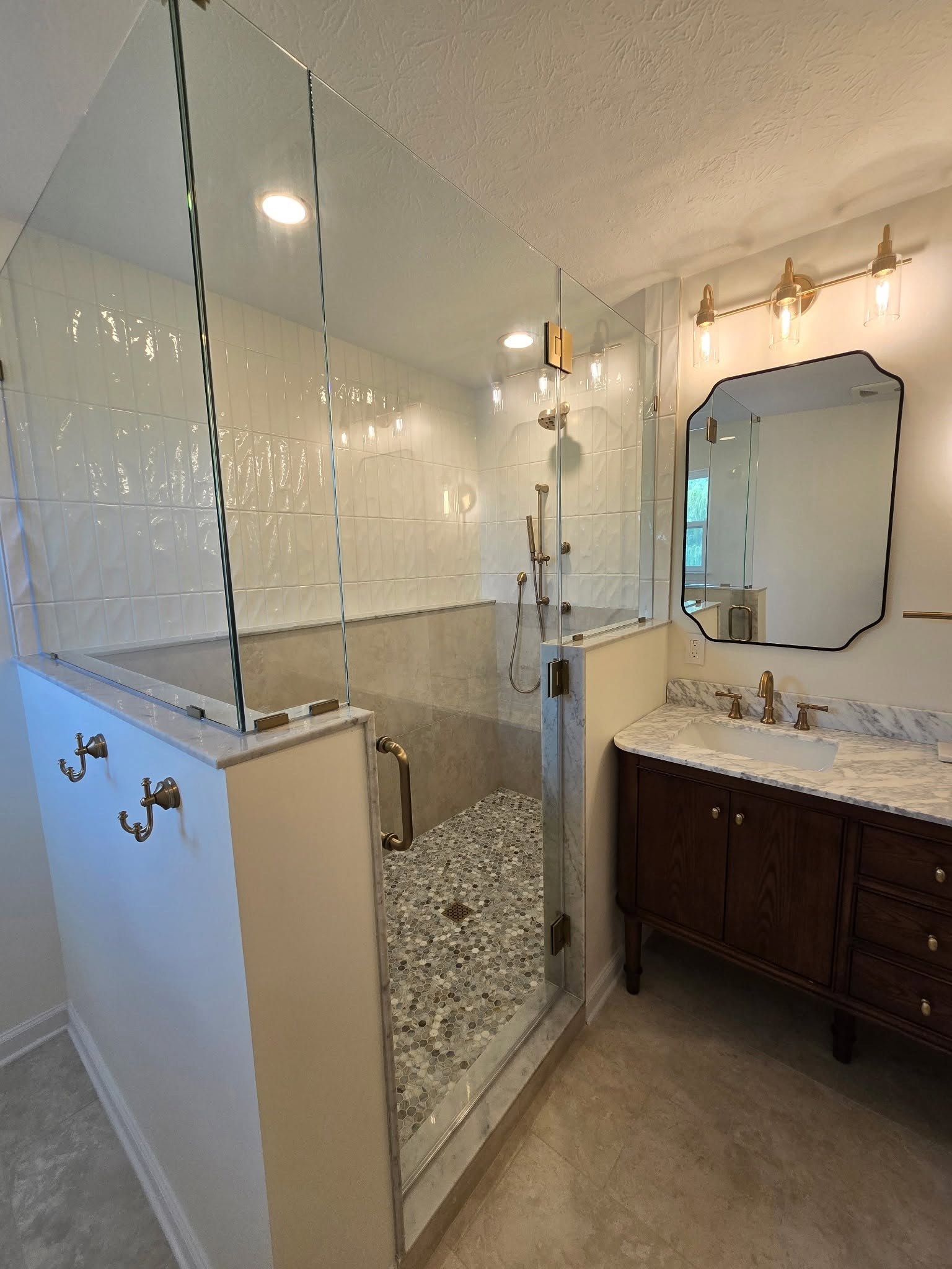 Walk-in shower with frameless glass and hexagon marble mosaic floor Fishers Indiana