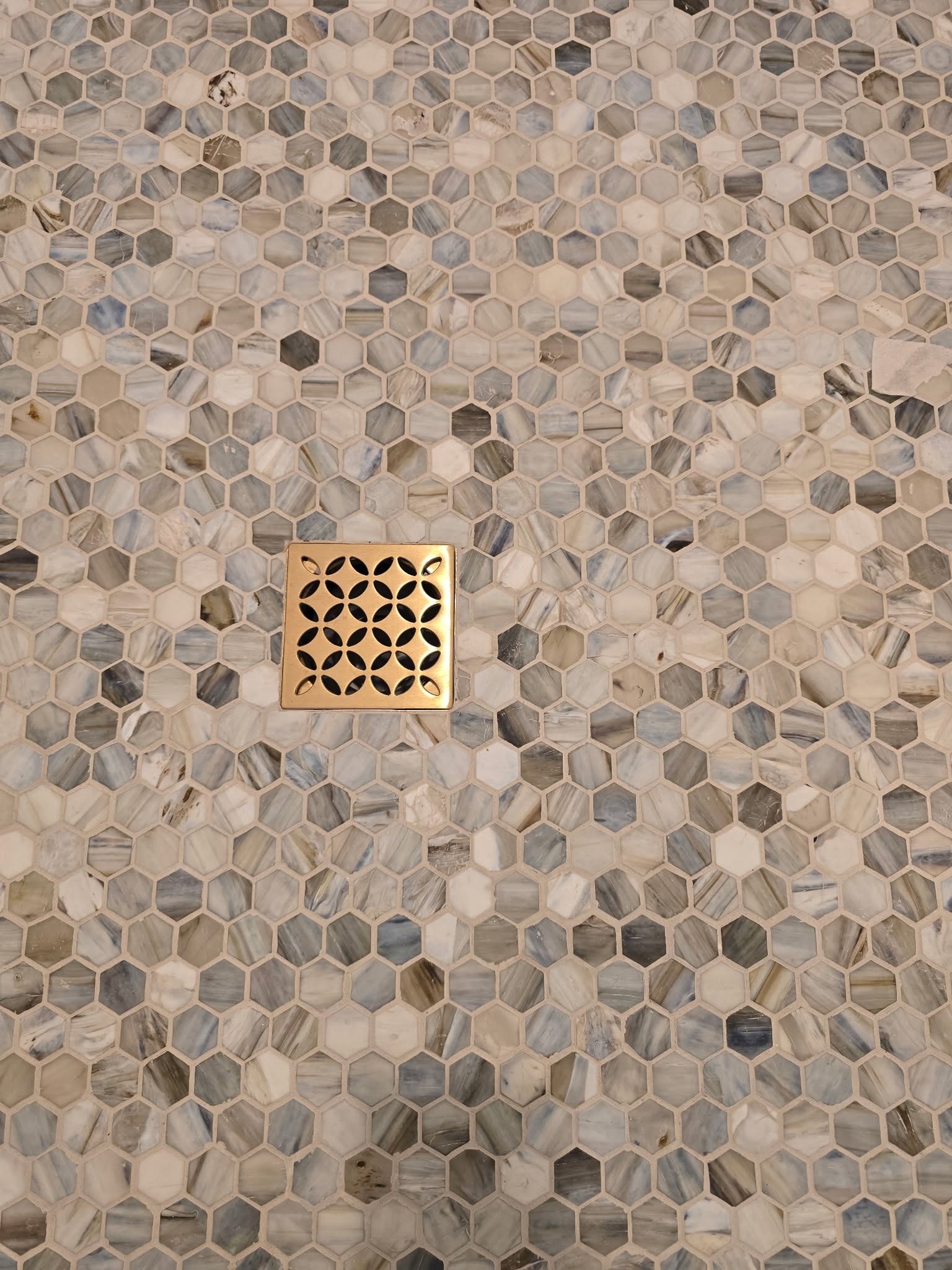 Hexagon marble mosaic shower floor with decorative square drain Fishers IN