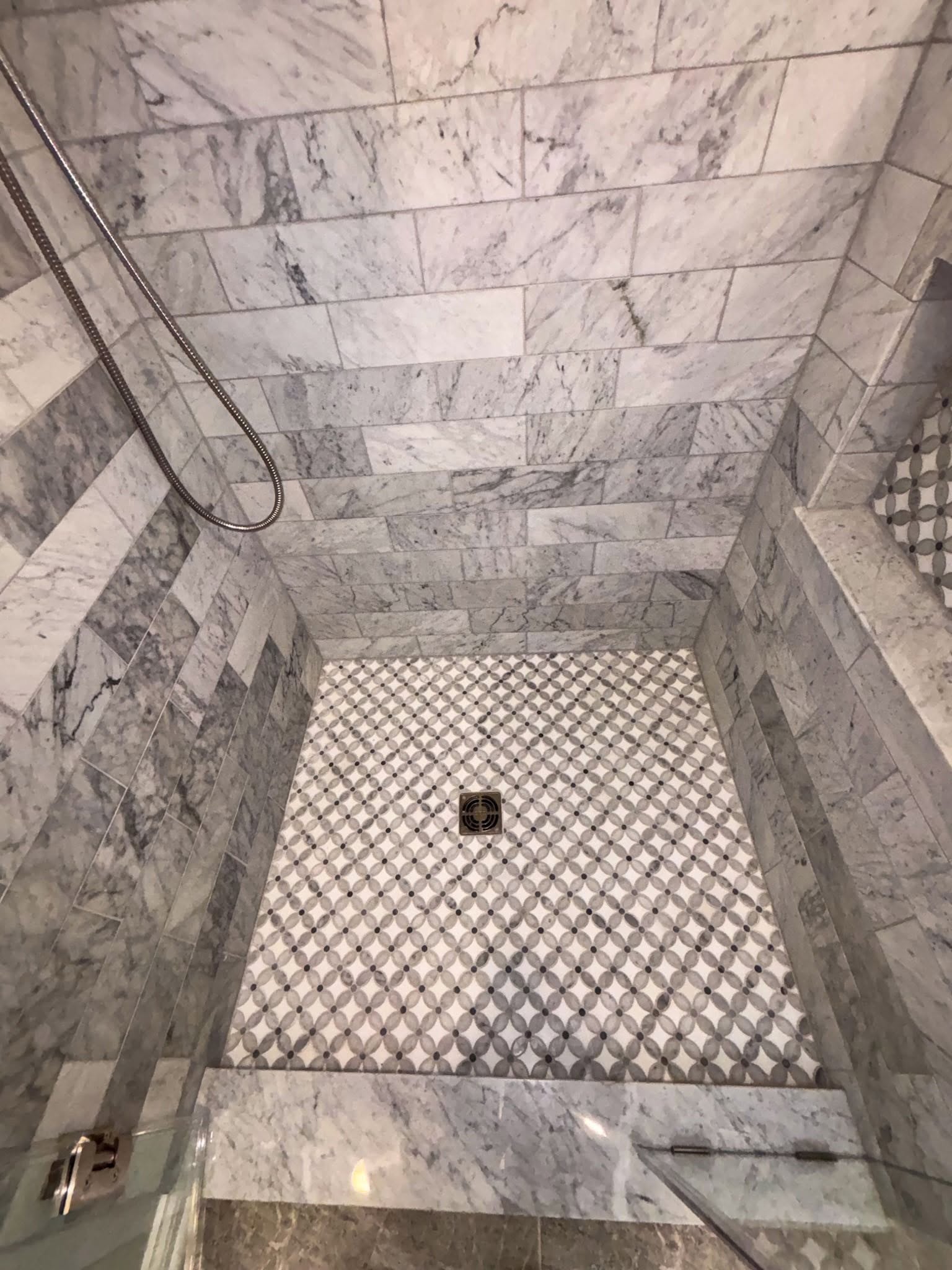 Marble shower with mosaic floor accent Fishers Indiana