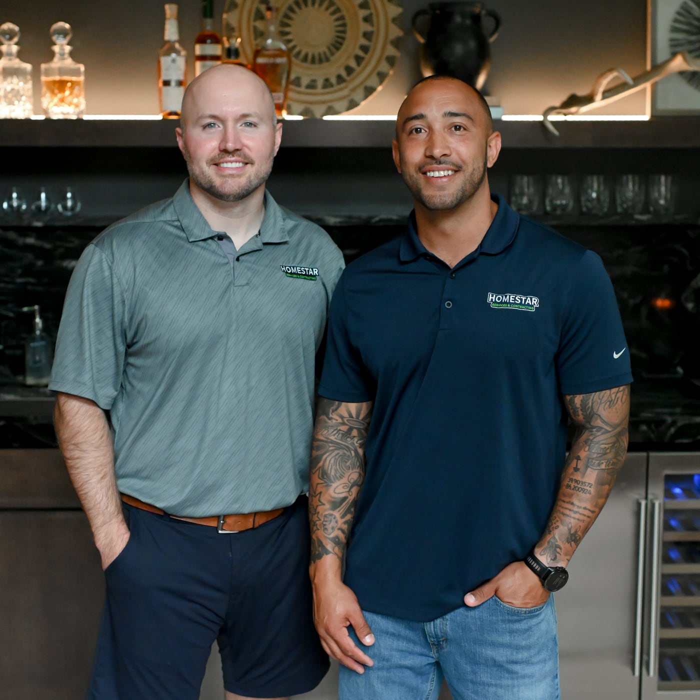 HomeStar co-founders Eric Farr and Robb Rice in a finished basement bar in Zionsville, Indiana