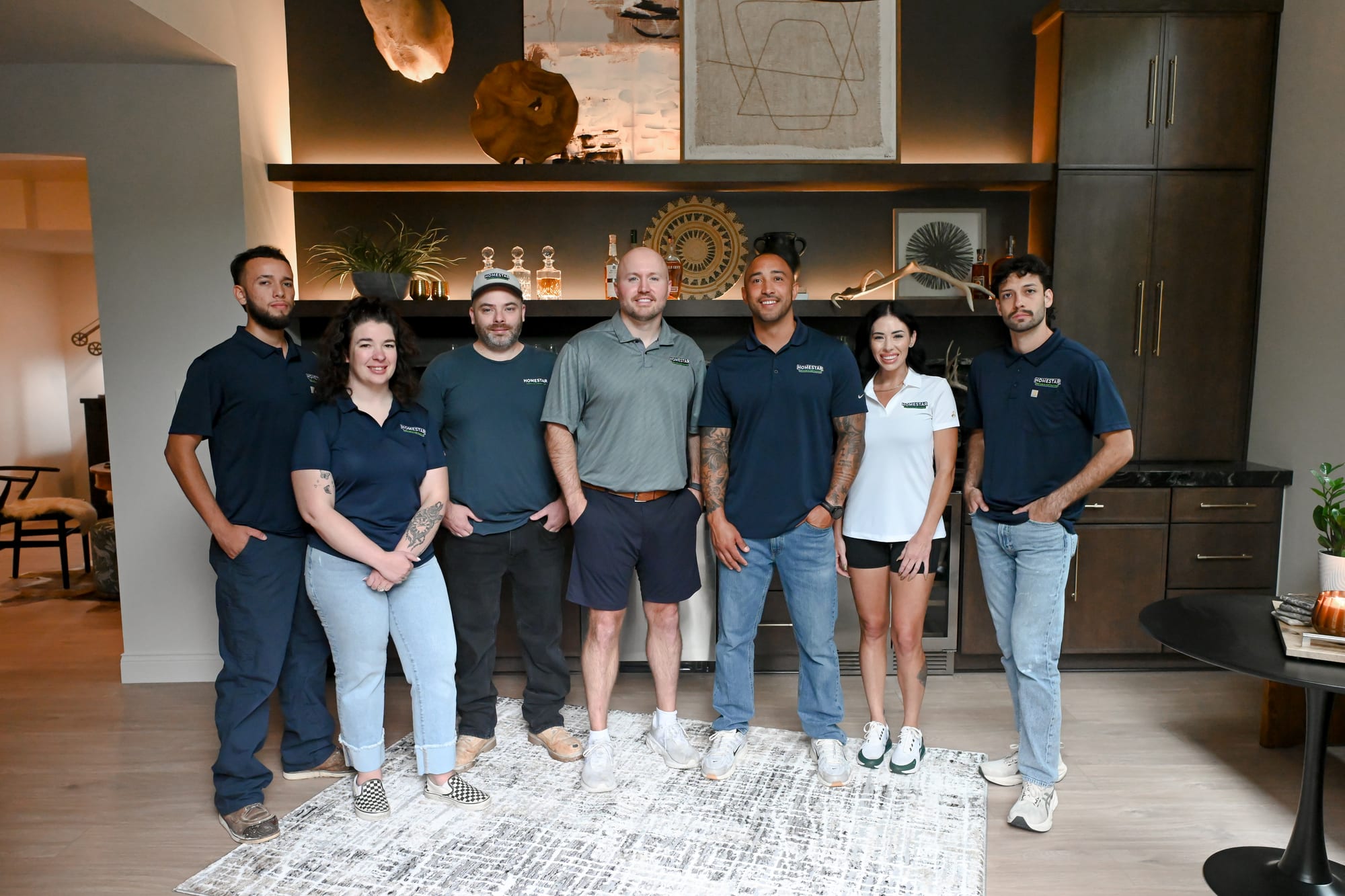 The HomeStar Services & Contracting team in a finished lower level in Zionsville, Indiana
