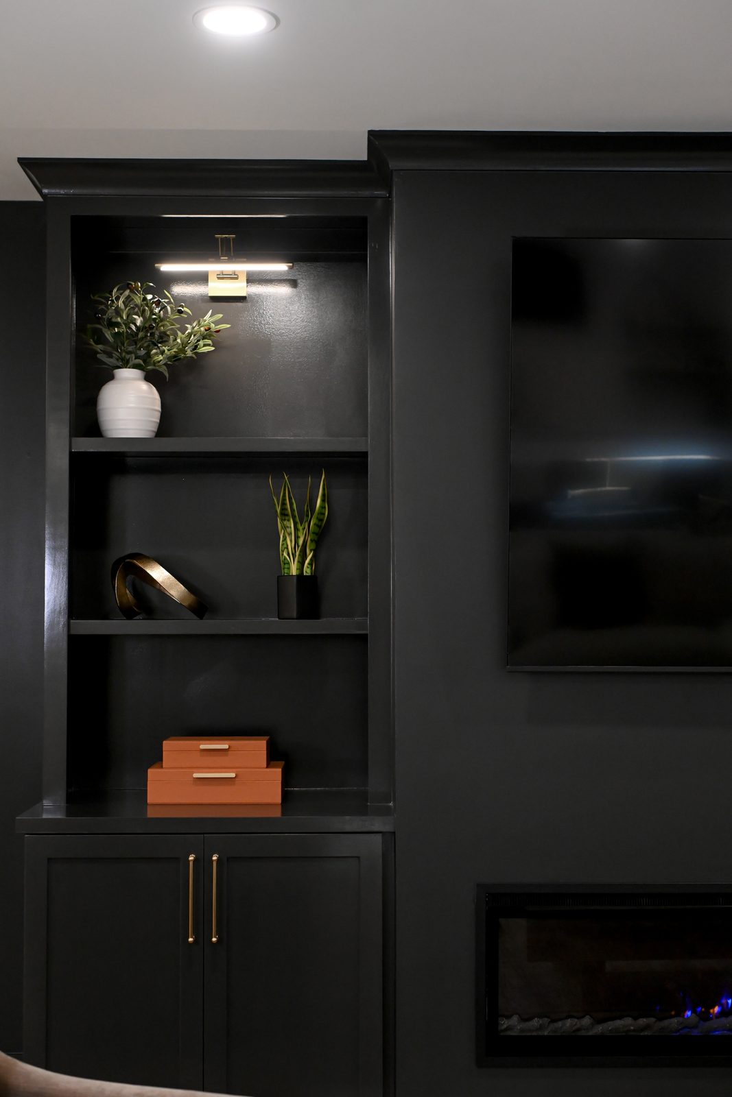 Lit black built-in shelving detail basement Westfield IN
