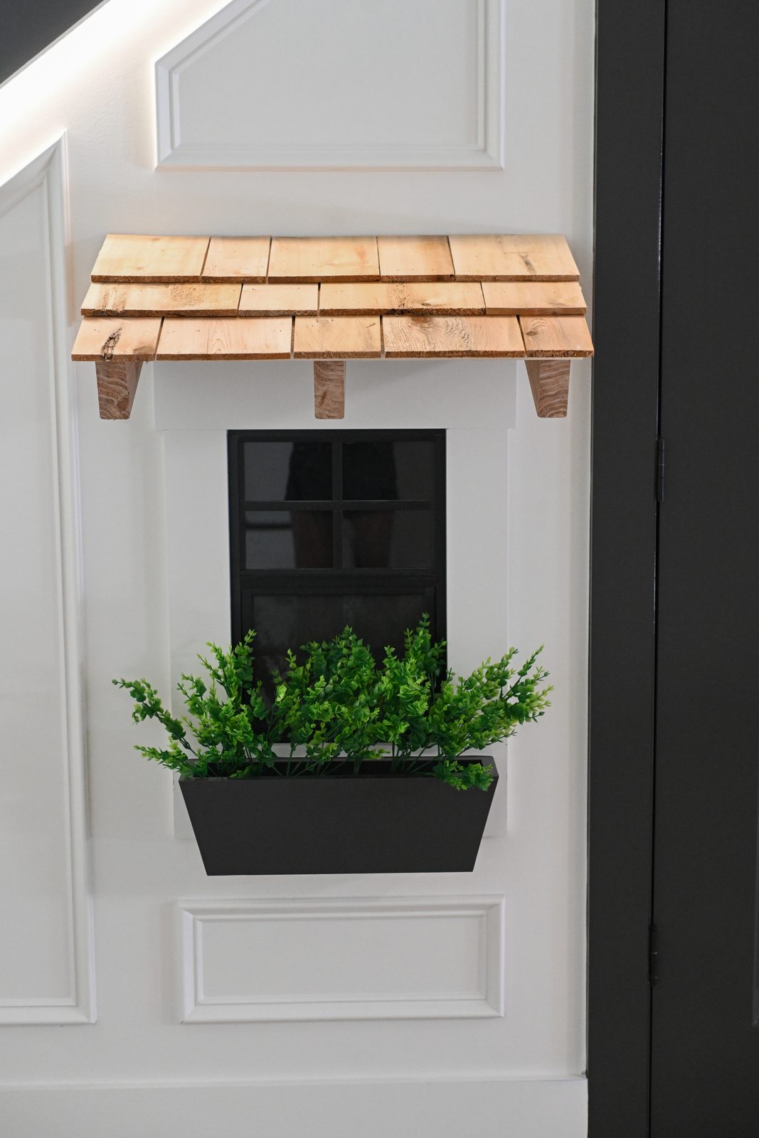 Cedar awning and window box over basement play door Westfield IN