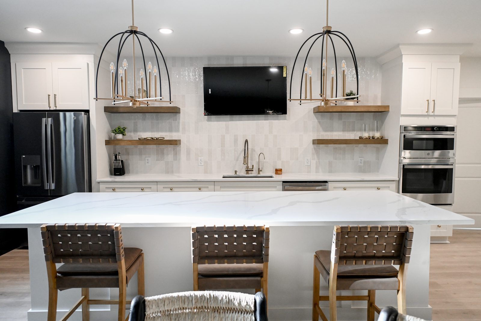 Basement bar island with leather counter stools Westfield IN