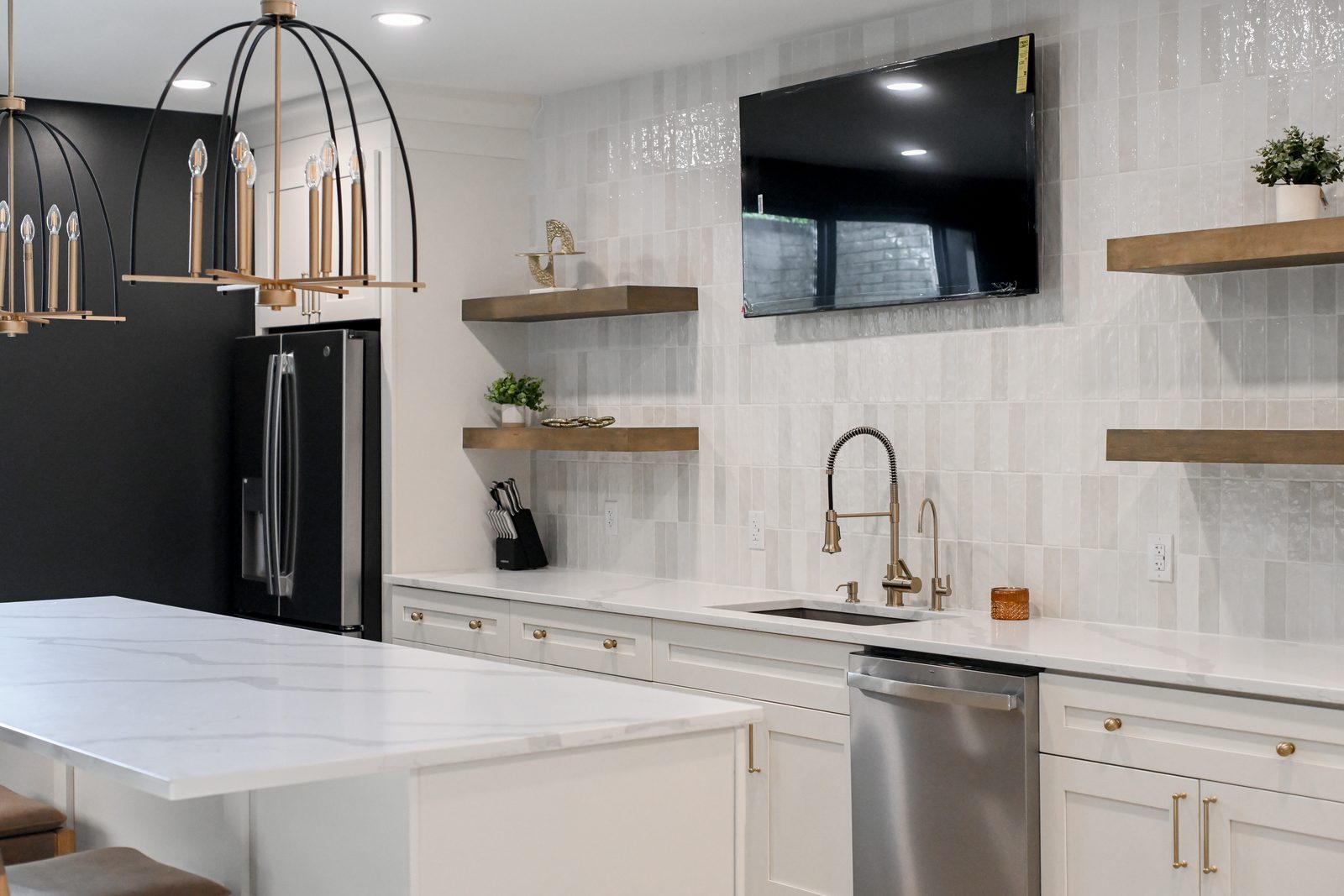 Basement wet bar sink and brass faucet with tile backsplash Westfield Indiana