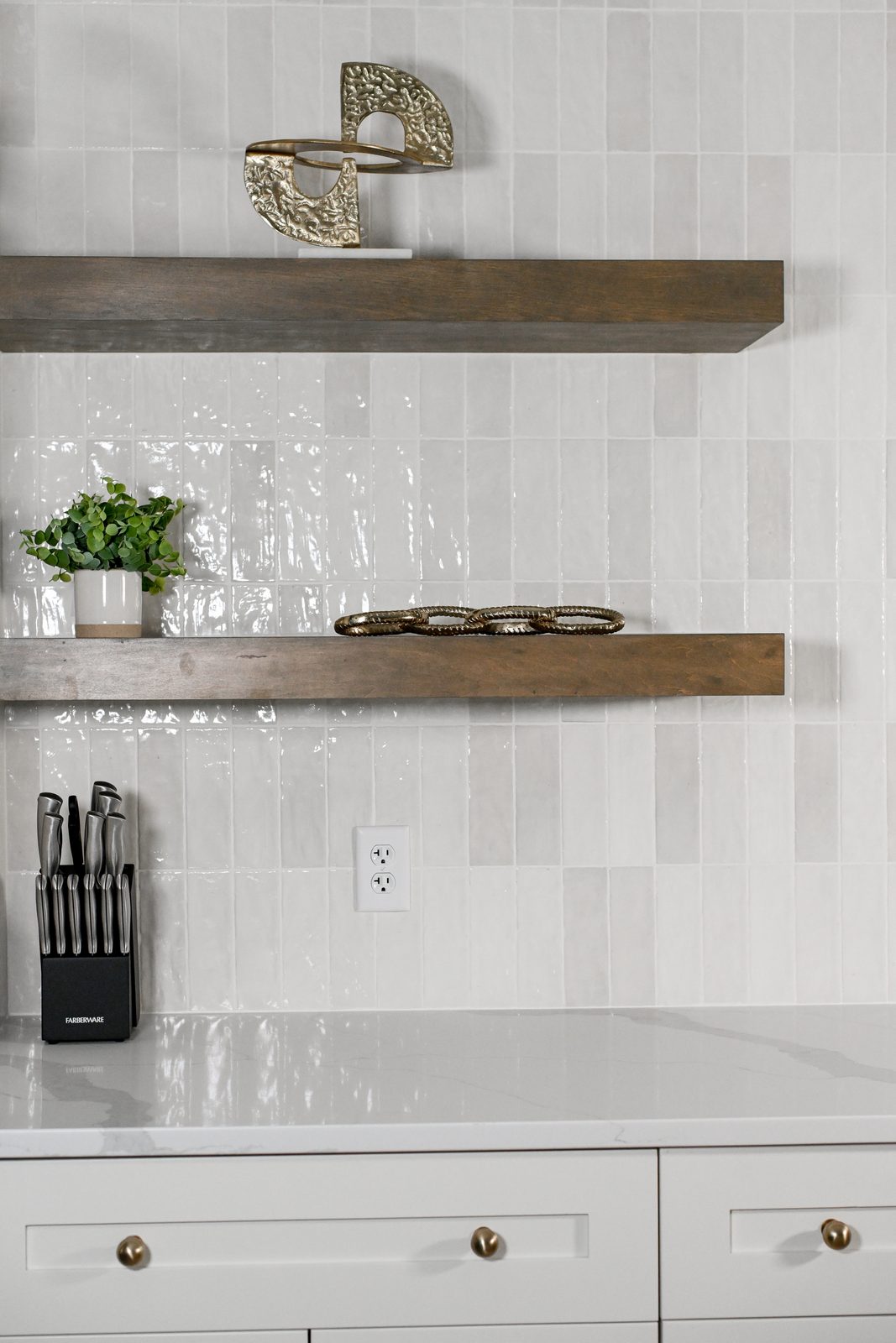 Stained floating shelves on stacked tile basement bar wall Westfield IN