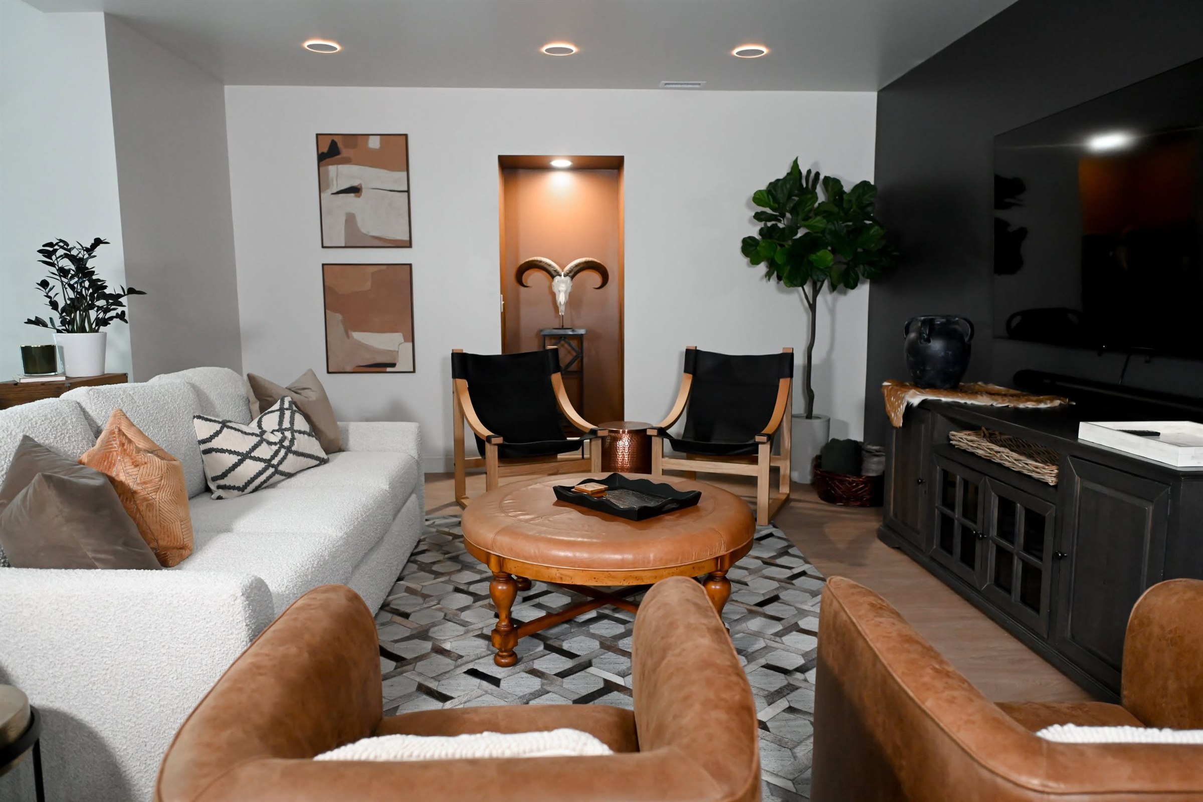 Basement media lounge with dark feature wall Zionsville Indiana