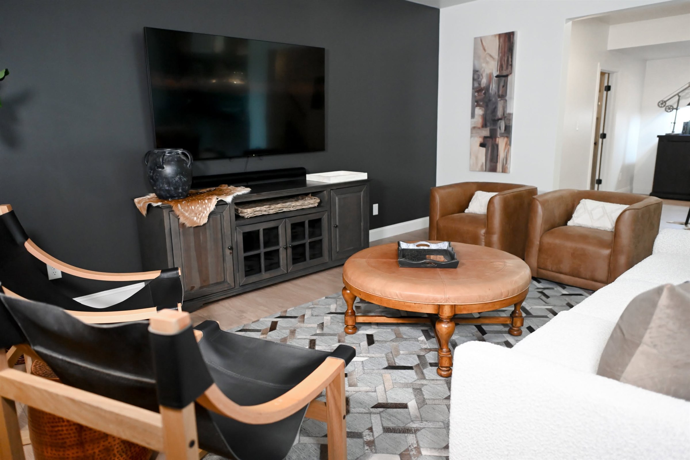 Finished basement lounge seating and television wall Zionsville IN