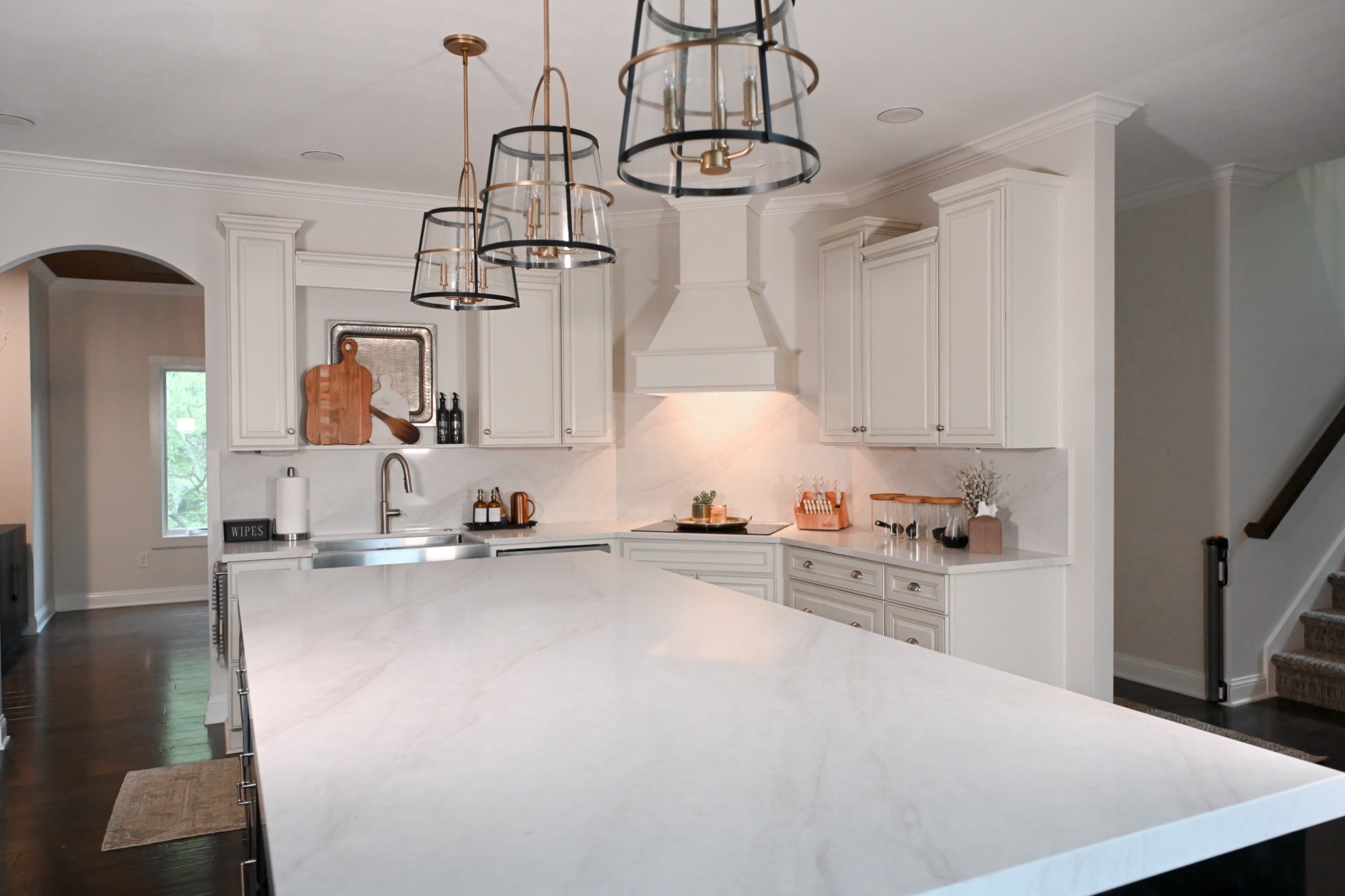 Renovated kitchen with marble island and full height stone slab backsplash Zionsville IN