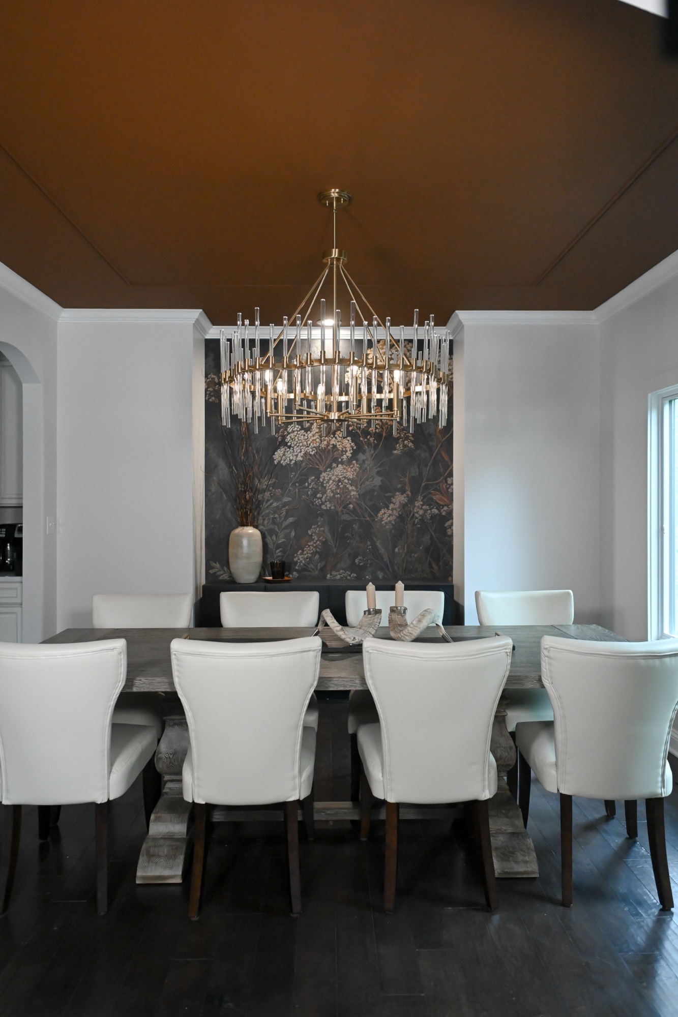 Dining room with dark botanical mural bronze tray ceiling and brass chandelier Zionsville IN