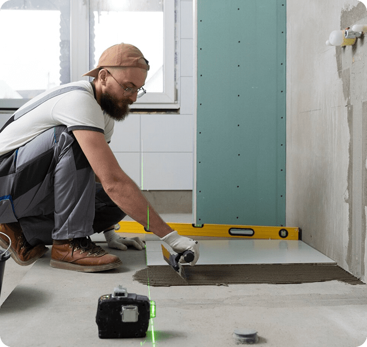 bathroom floor installer at work